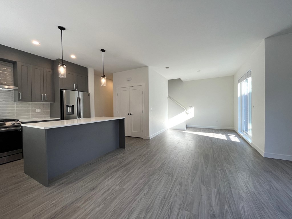 a kitchen and living room in a new home