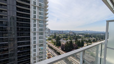 A view from a high-rise building looking out over a cityscape.