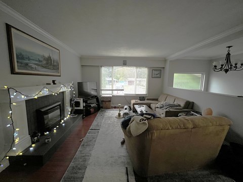 A living room with a fireplace and a couch.