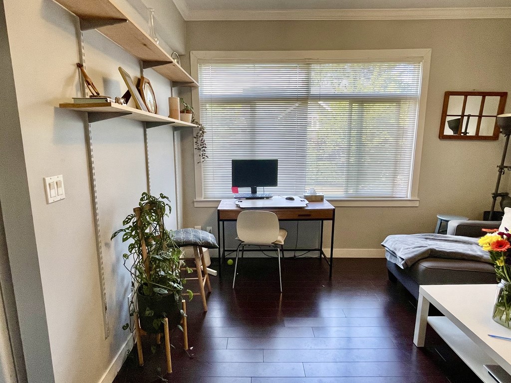 a room with a desk and a window