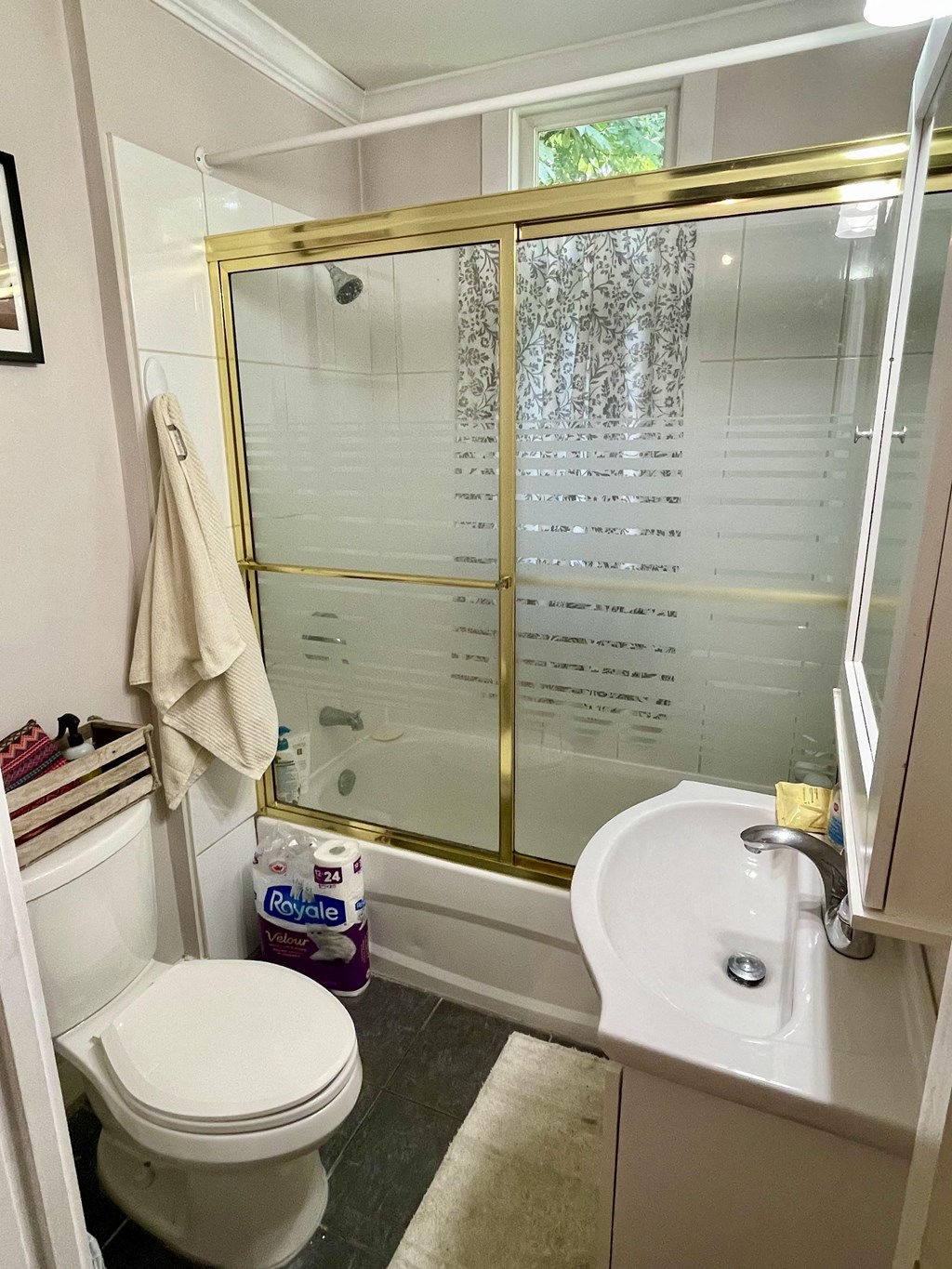 a small bathroom with a toilet sink and shower