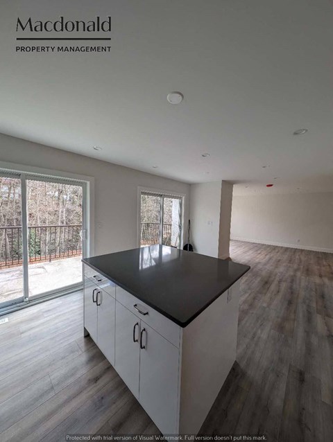 a kitchen with a large island in the middle of it