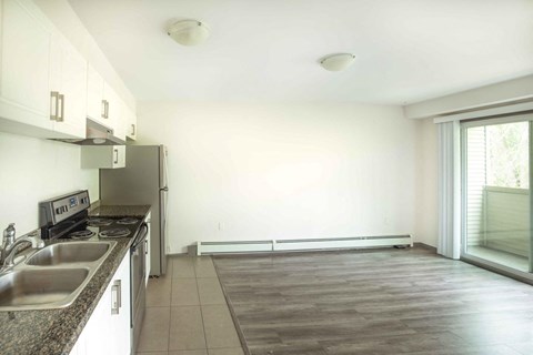 a kitchen with a sink and a refrigerator