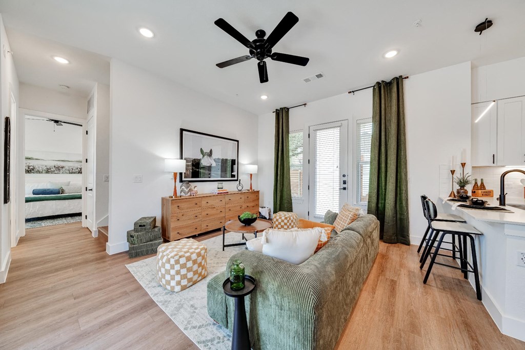 Living room with large couch and entertainment center