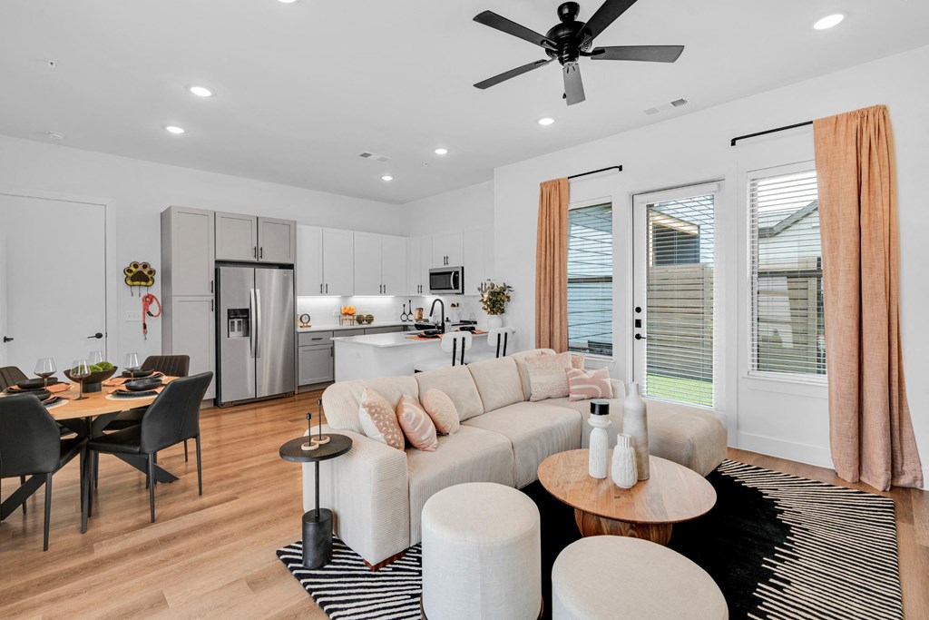 Living room looking into dining and kitchen space