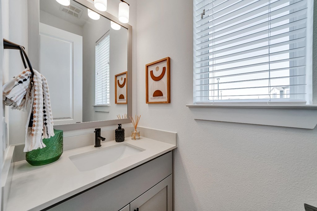 Guest bathroom with window and sink