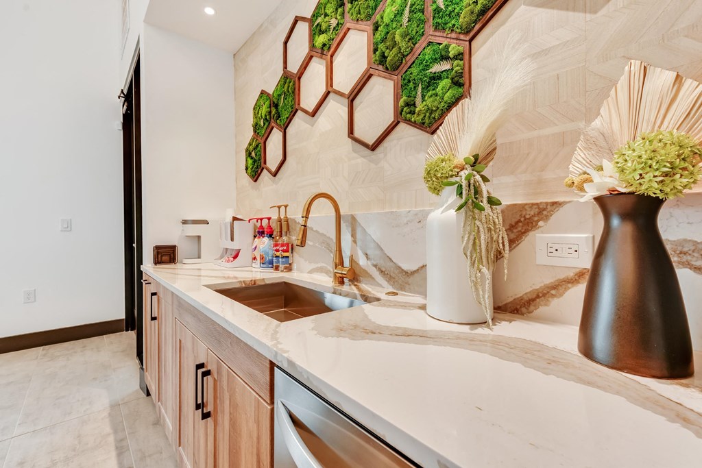 Resident lounge stocked with coffee and a fridge for drinks