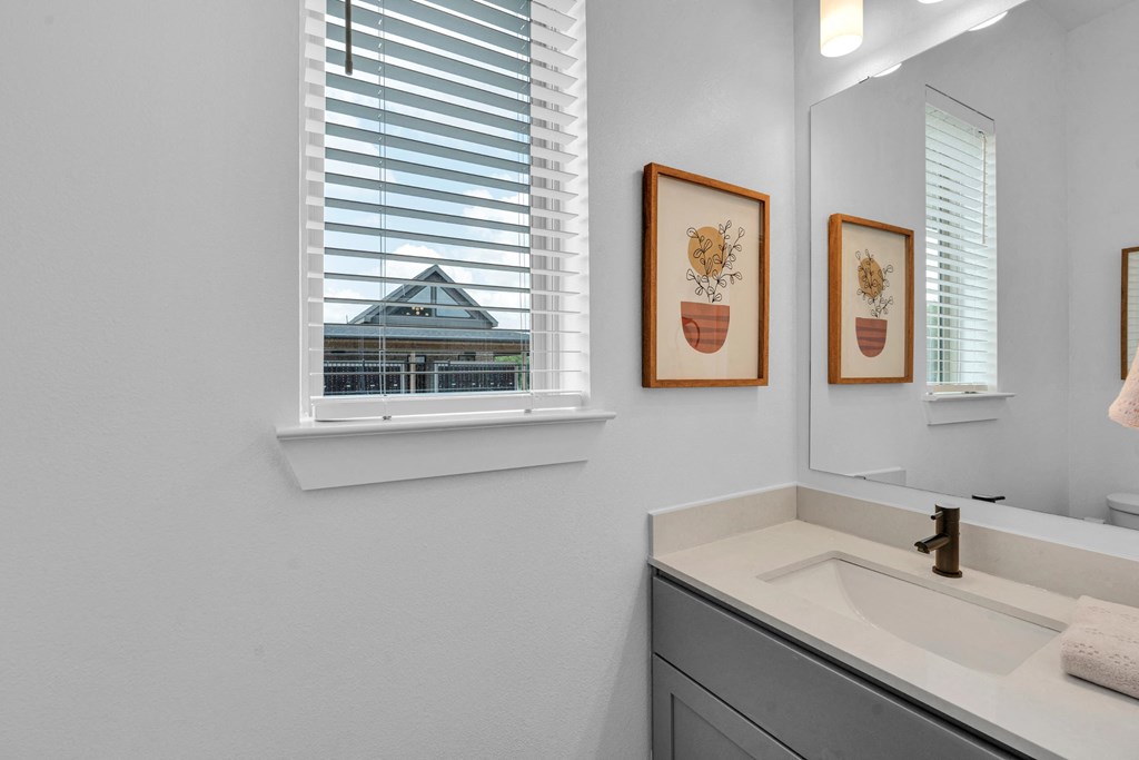 Guest bathroom with window and sink