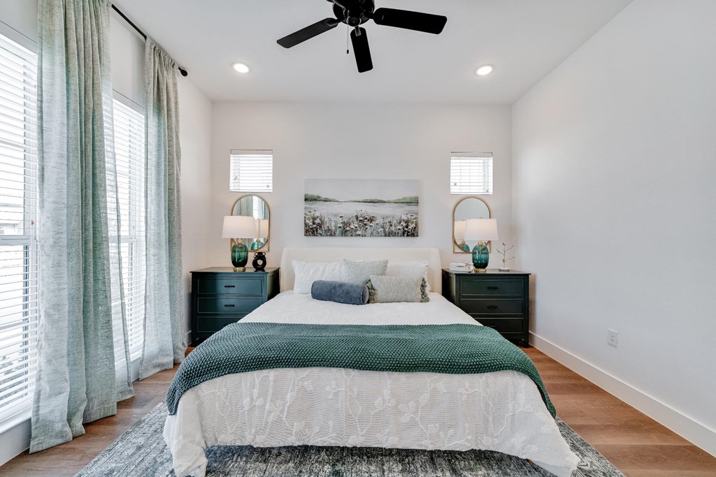 bedroom with queen size bed and ample natural lighting