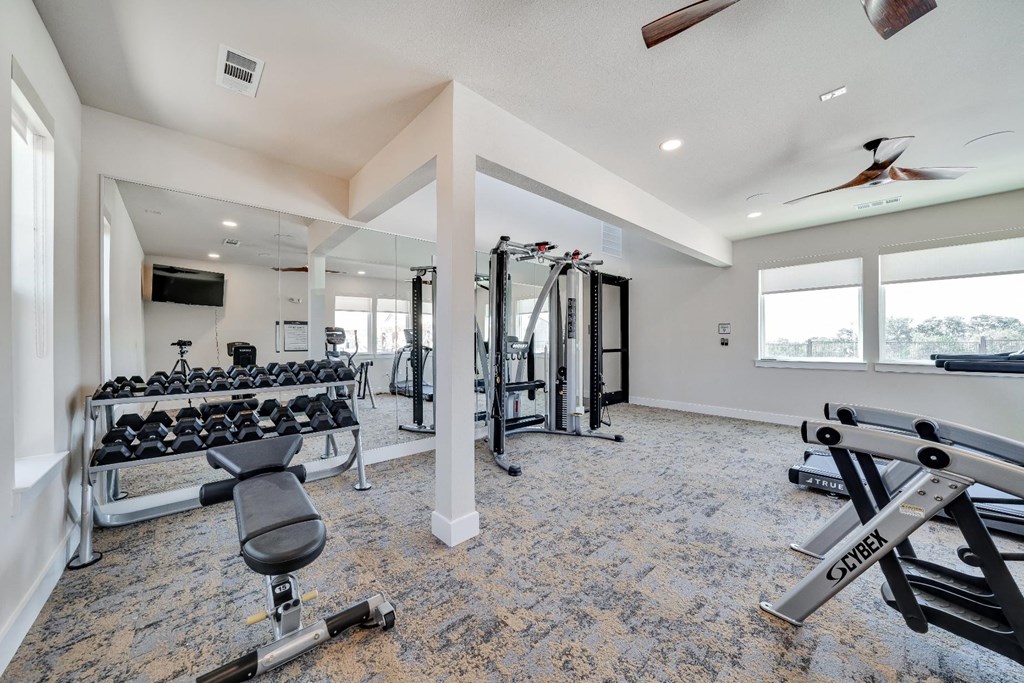 fitness center with ample machines for working out