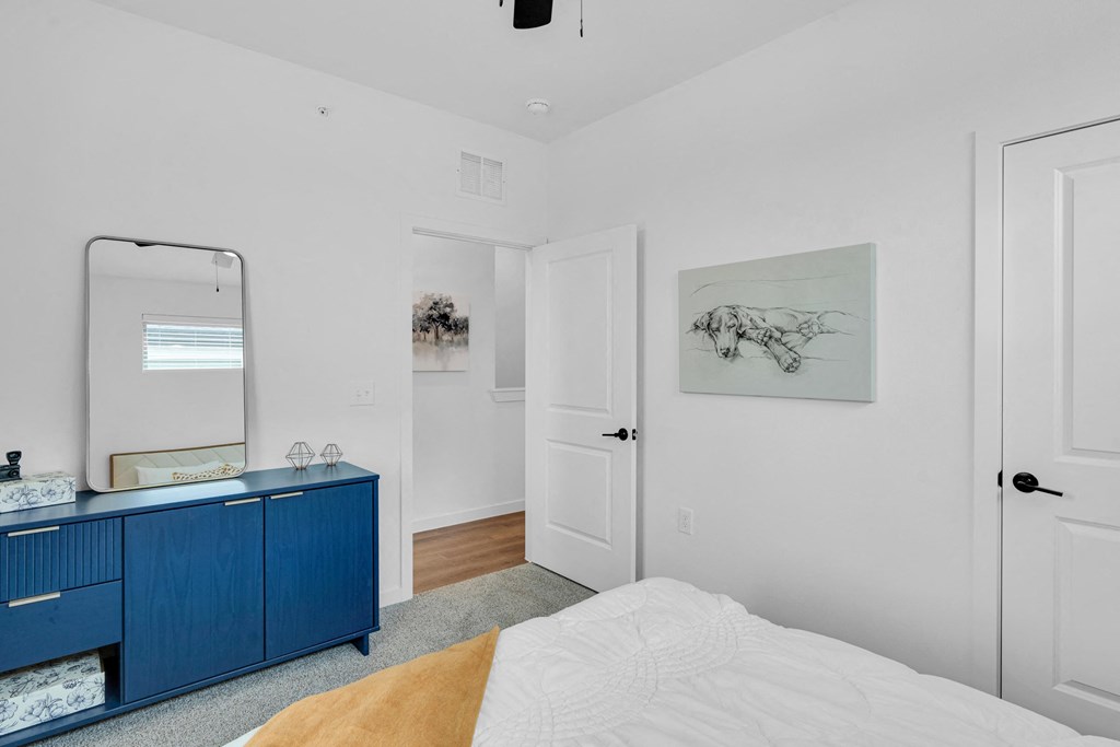 bedroom with queen size bed and ample natural lighting