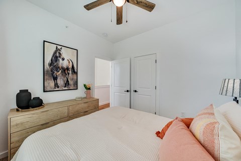 bedroom with queen size bed and ample natural lighting