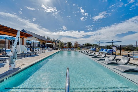 A long rectangular pool with a diving board in the middle.