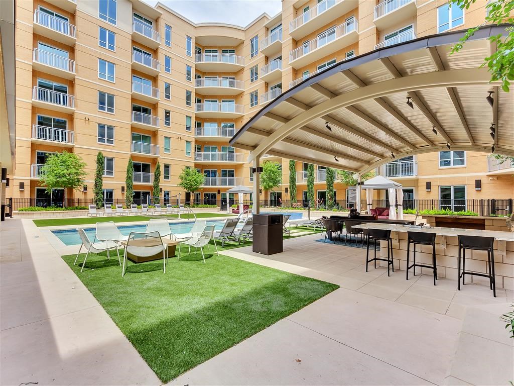Community courtyard with pool and green space.