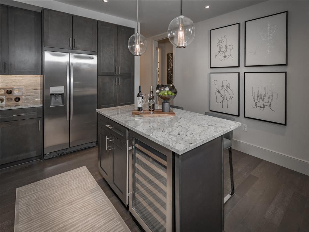 Double sided refrigerators and wine-fridges in select floor plans.