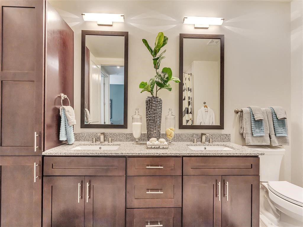 Bathroom with double mirrors and sinks.