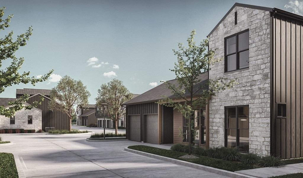 A modern residential area with houses and trees.