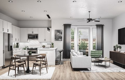 A modern kitchen with a dining table and chairs.