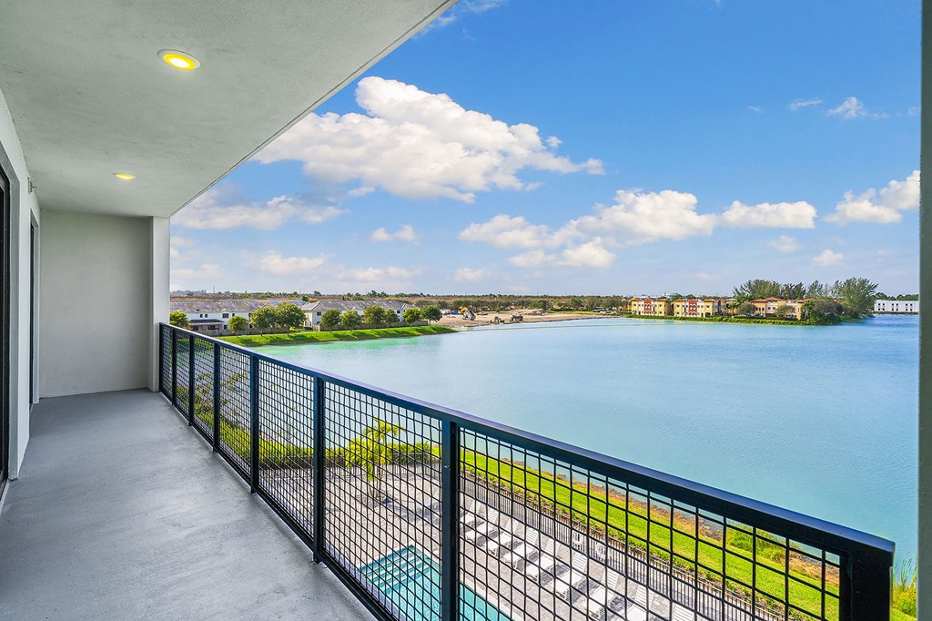 The view from the balcony of a condo overlooking the water