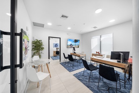 a living room with a couch and a table with chairs