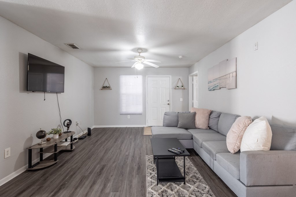 a living room with a couch and a tv