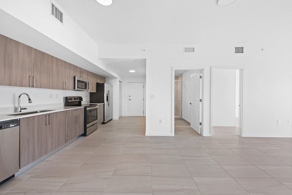 a kitchen and hallway in a 555 waverly unit