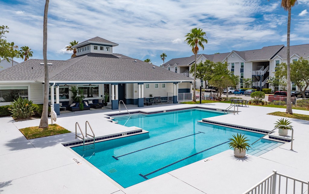 the preserve at ballantyne commons pool and building with palm trees