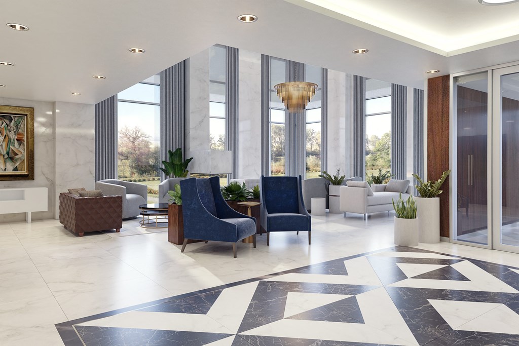a lobby with blue chairs and a black and white checkered floor