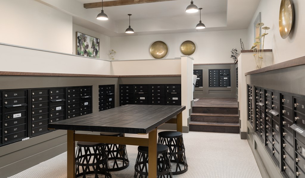 a tasting room with a wooden table and chairs and wine racks