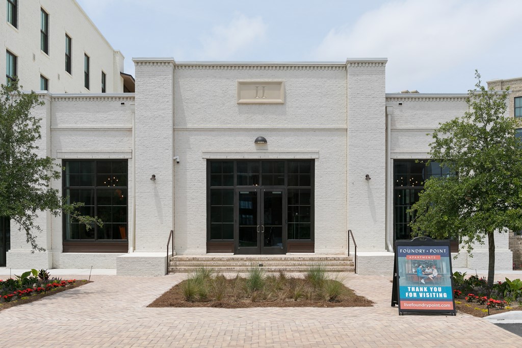a white building with a sign in front of it