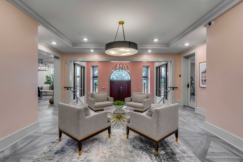a living room with couches and chairs and a table