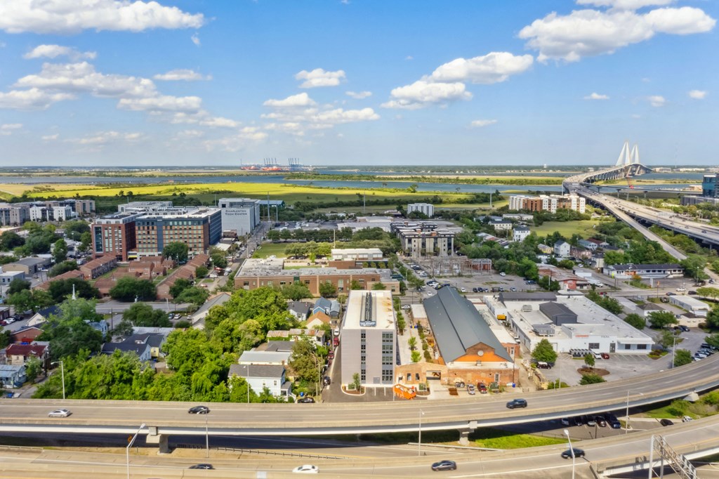 an aerial view of a city with highways and buildings