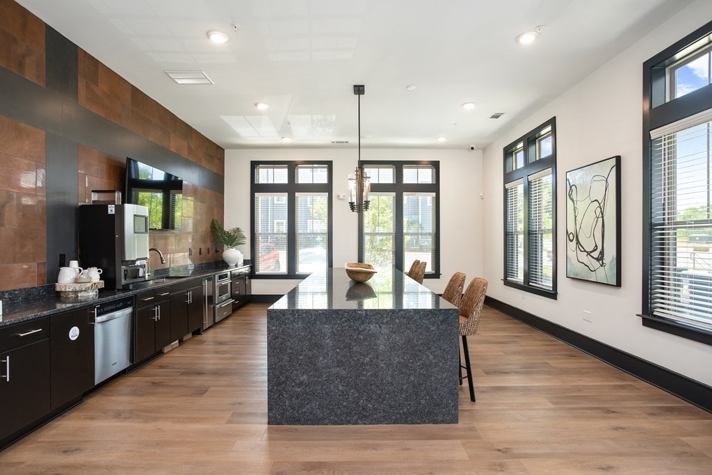 a large kitchen with a large island in the middle of it