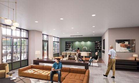 A man in a blue shirt is sitting on a brown couch in a modern living room.