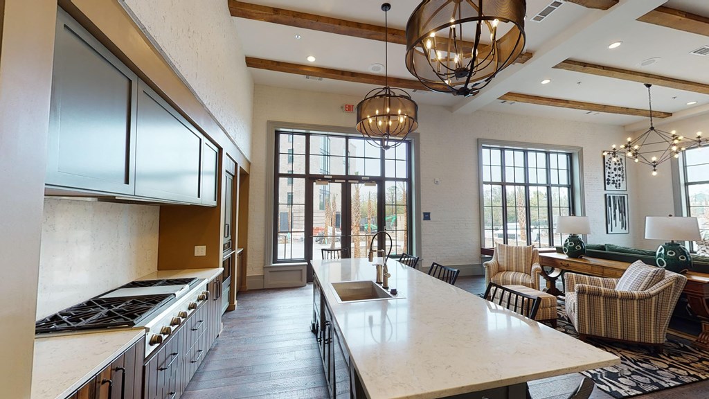 a large kitchen and living room with a large counter top