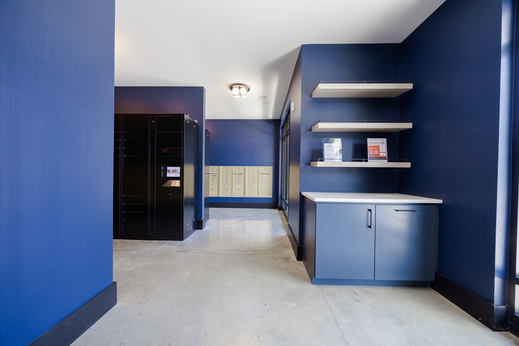A kitchen with blue walls and cabinets.