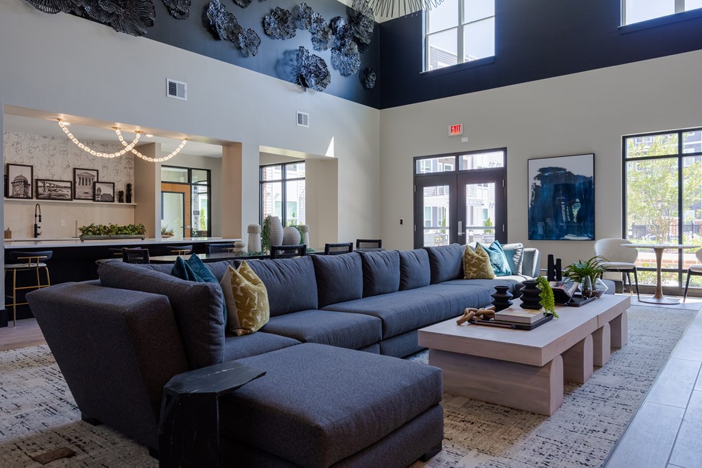 A living room with a grey sofa and a coffee table.