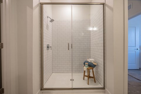 Subway Tile, Clean Aesthetic, Walk-In Shower at Madison Fountains Apartment Community near St. Johns, Florida