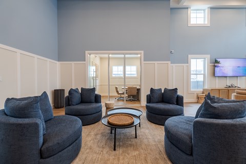 A living room with grey couches and a coffee table.