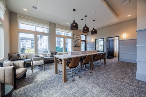A conference room with a long table and chairs.