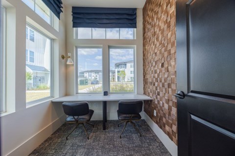 A room with a table and two chairs.