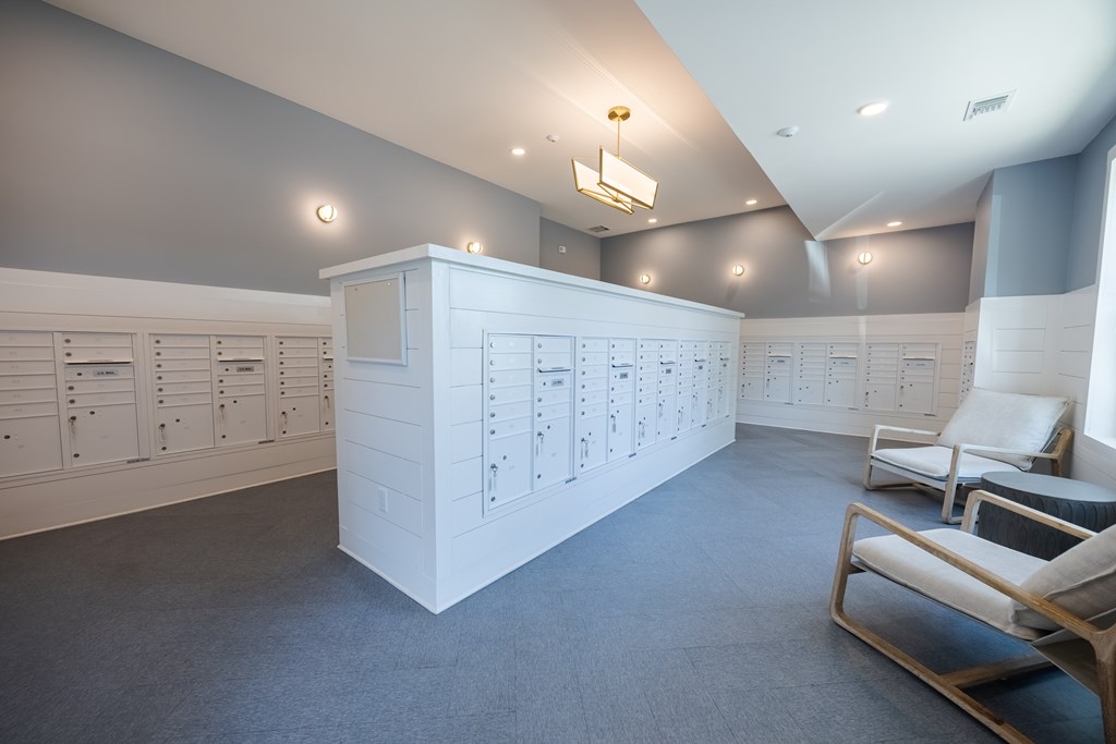 A room with a white cabinet and a chair.