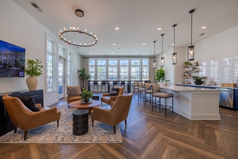 A modern living room with a large window and a piano.
