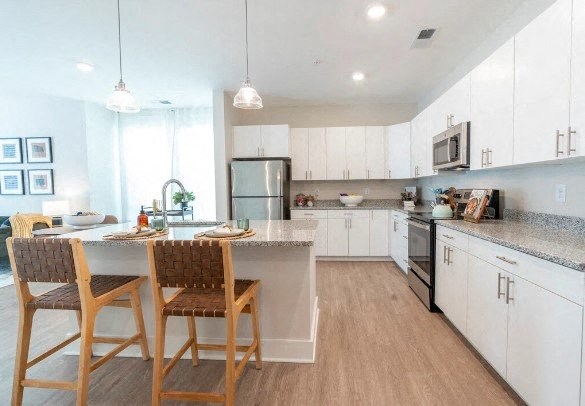 a kitchen with a table and chairs in it