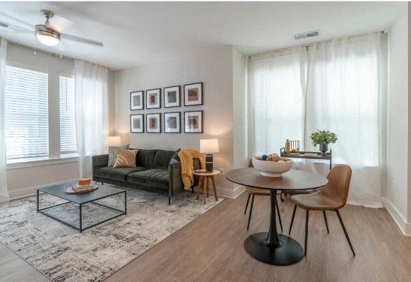 a living room with a table and a couch