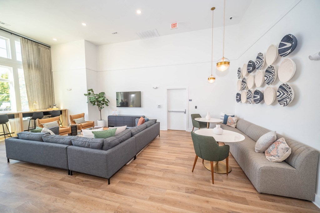 a living room with couches and chairs and a table