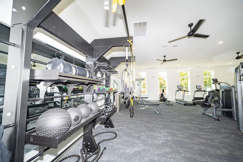 the kitchen is equipped with a large stainless steel cook stove and a large workspace with