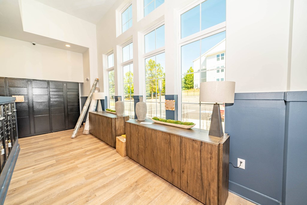 a large room with a counter and large windows