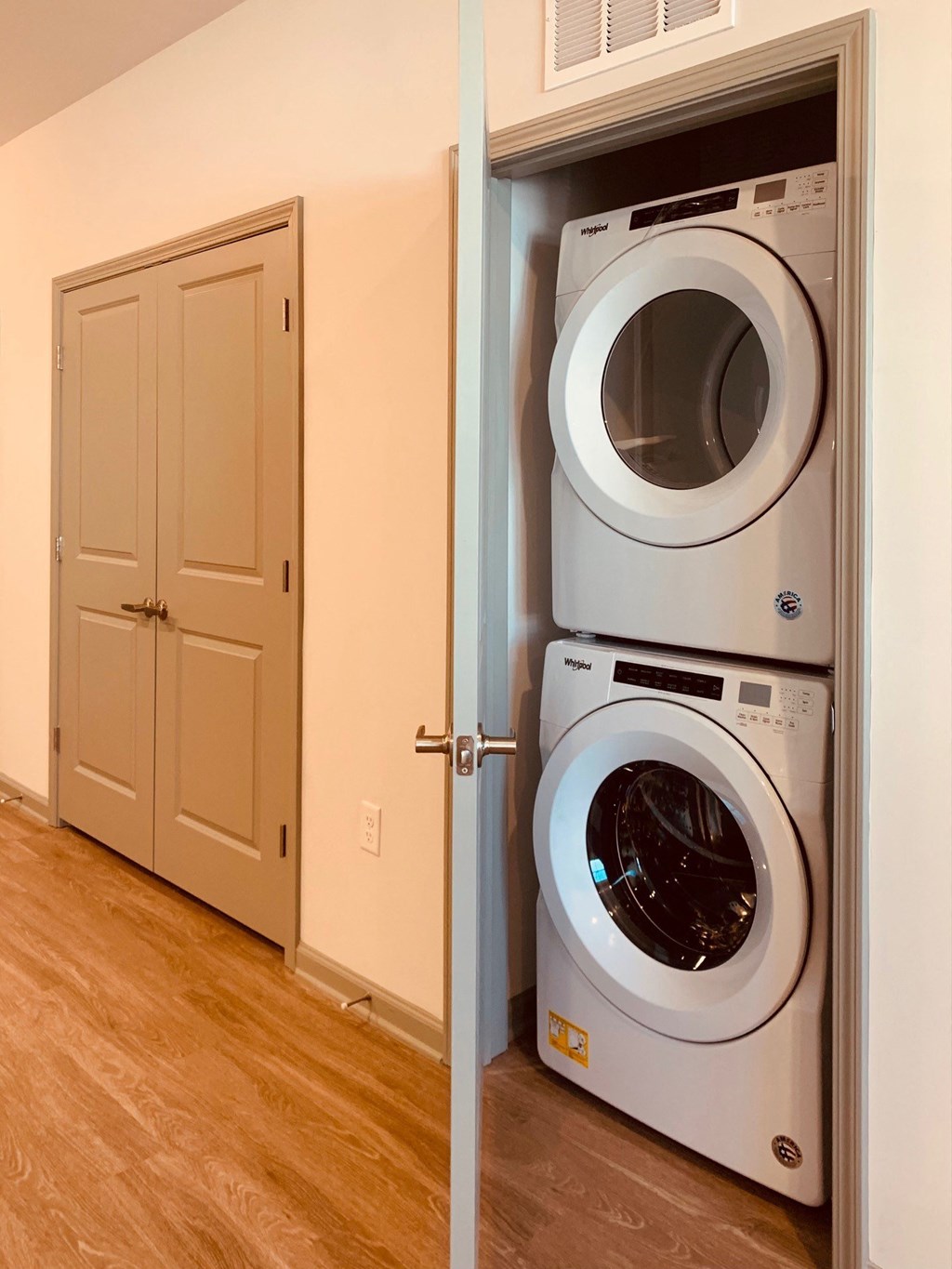 a front loading washer and dryer in a laundry room