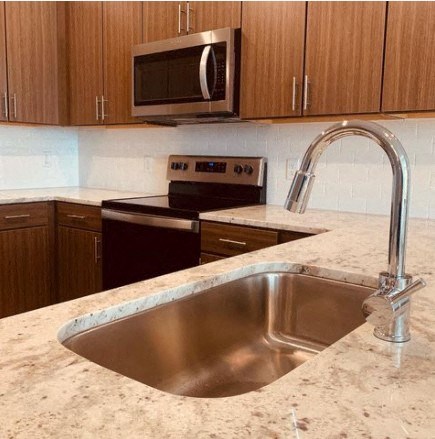a kitchen with a sink and a microwave